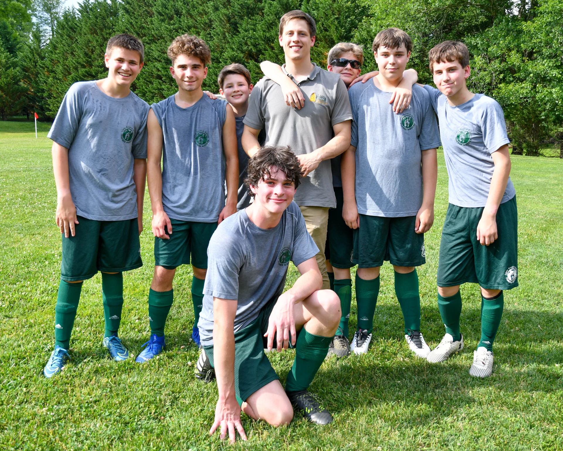 soccer team and coach on field