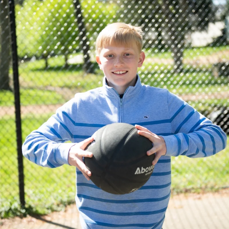 student with basketball