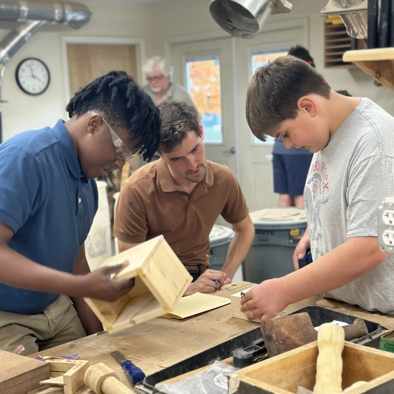student and teacher in Woodshop class