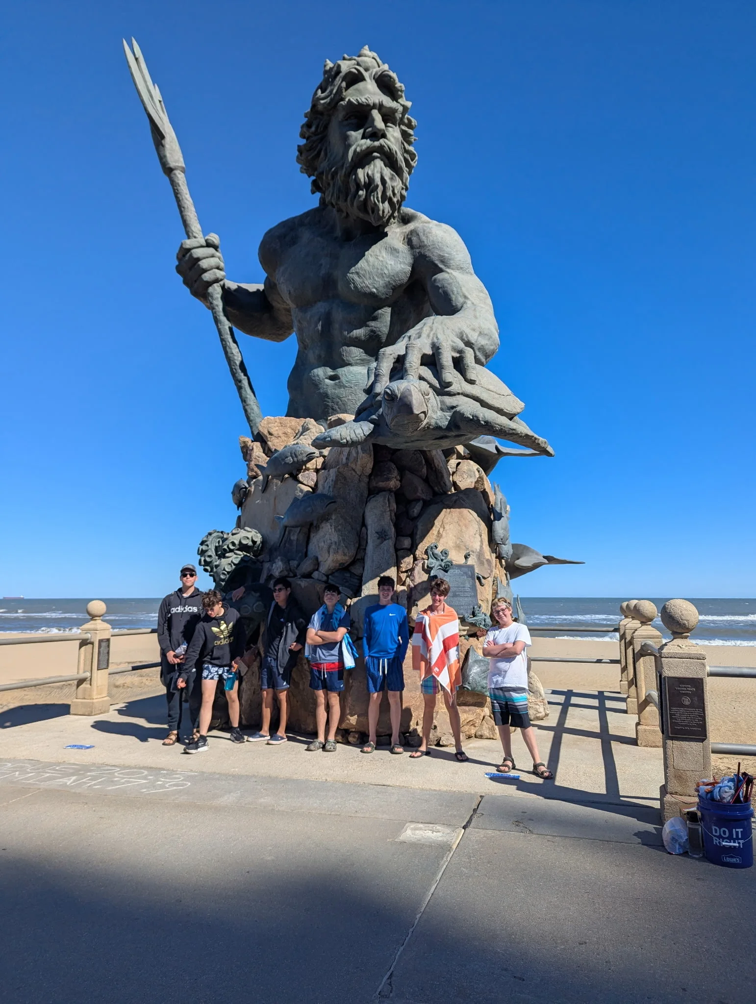 Kewick Wayfinders standing in front of a statue of Poseidon