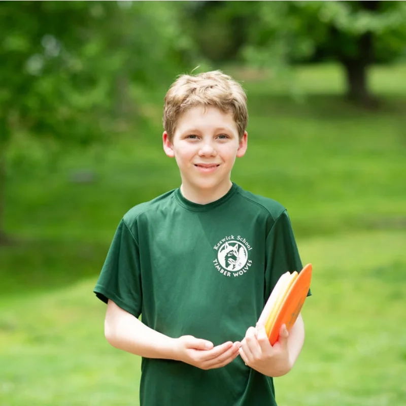 student with frisbee