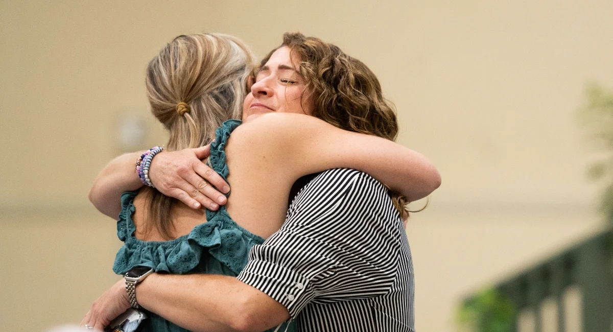 parent hugging student