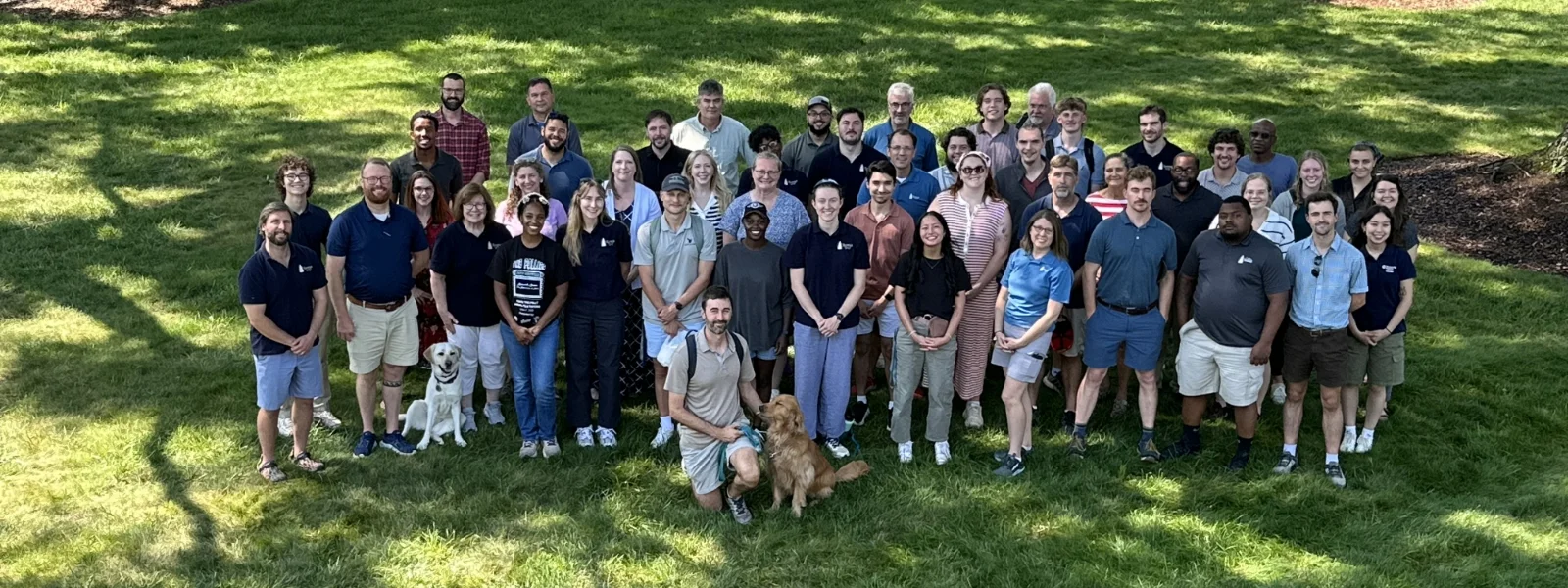 all-staff portrait on campus lawn
